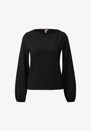 Schwarze, strukturierte Langarmbluse mit rundem Ausschnitt und elastischen Bündchen, vor einem schlichten weißen Hintergrund präsentiert.