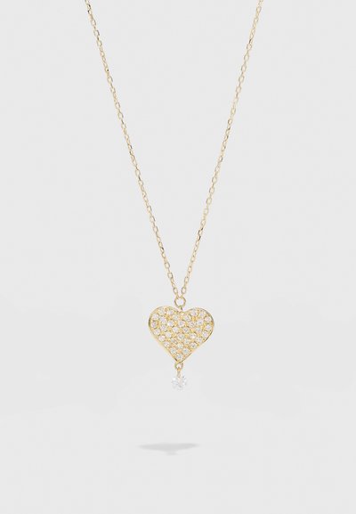 Zelta kaklarota ar sirds formas piekariņu, rotātu ar caurspīdīgiem akmeņiem, apakšā ar vienu caurspīdīgu kristāla pilienu.