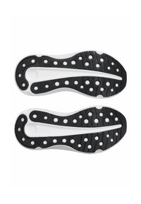 Black rubber shoe soles with white accents, featuring a patterned surface with circular cutouts and grooves for traction.