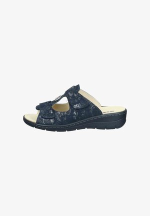 Navy blue open-toe women's sandal with adjustable straps, floral patterns, cushioned beige insole, and black wedge sole.