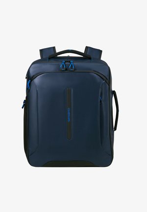 Navy blue backpack made of durable fabric, featuring black accents, adjustable straps, padded handle, and contrasting blue zipper pulls.