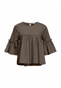 Brun bomuldsbluse med rund halsudskæring, flagrende ærmer og en voluminøs buste. Har en nøglehulåbning på bagsiden.