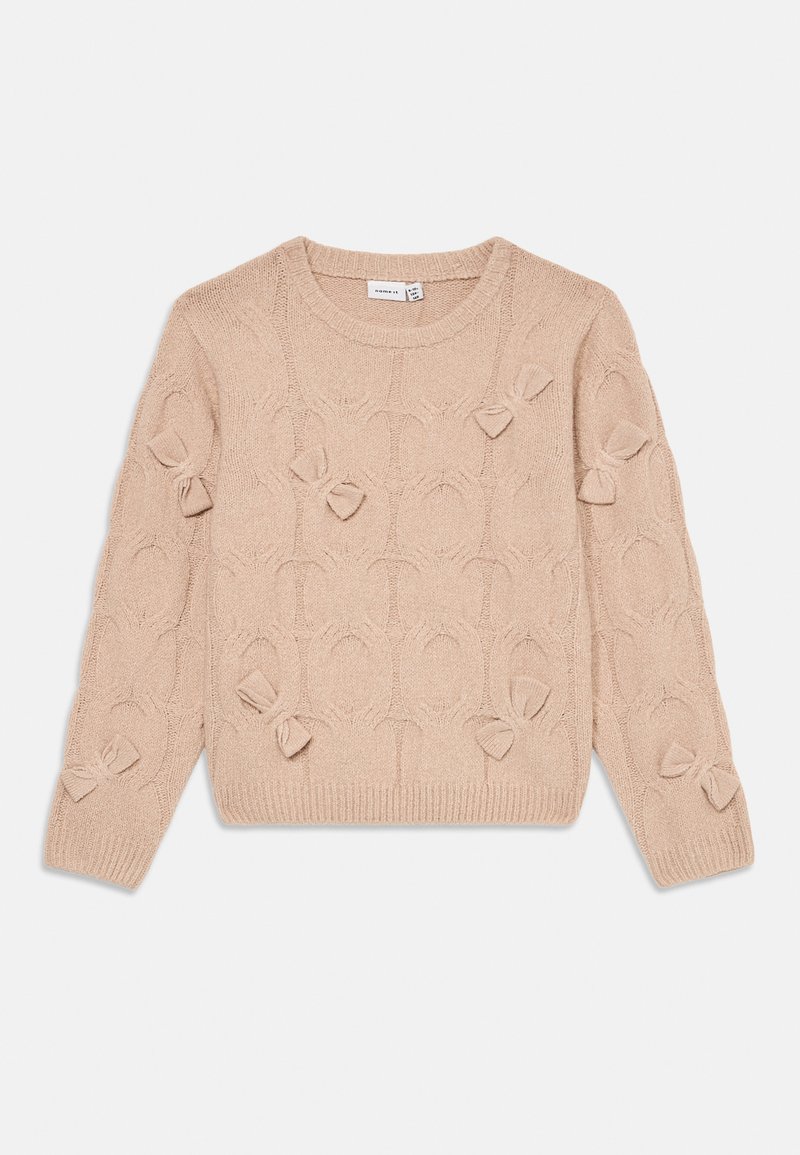 Beige kötött pulóver, textúrált mintázattal, amelyen kis masnik találhatók az elején, valamint bordás mandzsettákkal és szegéllyel. Klasszikus kerek nyakkivágás.