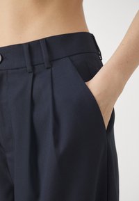 BLANCHE LION PANTS - Nadrágok - rinse