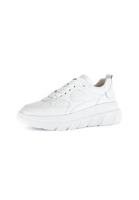 White leather sneaker with thick rubber sole, rounded toe, and lace-up front. Features textured accents on the sides and a padded collar.