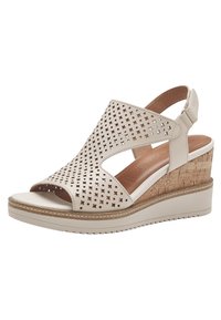 Sandali beige con zeppa, punta aperta, design traforato e tacco in sughero texturizzato. Presentano una tomaia in pelle e una suola in gomma con grip.