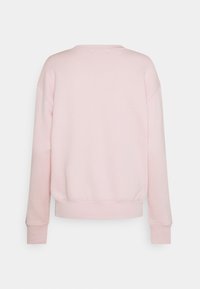 Ljusrosa sweatshirt med rund halsringning, långa raglanärmar och ribbad nederkant. Mjuk textur, minimalistisk design utan mönster eller detaljer.