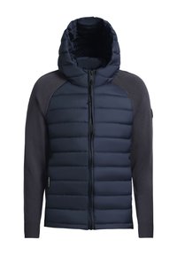 Veste bleu marine avec un corps matelassé et des manches en tricot. Équipée d'une fermeture éclair à l'avant et d'une capuche. Tissu texturé avec une finition lisse.
