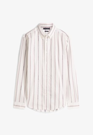 Λευκό πουκάμισο με κόκκινες και μπλε κάθετες ρίγες, μακριά μανίκια και κανονικό γιακά. Διαθέτει στρογγυλεμένη άκρη και κλασικά κουμπιά.