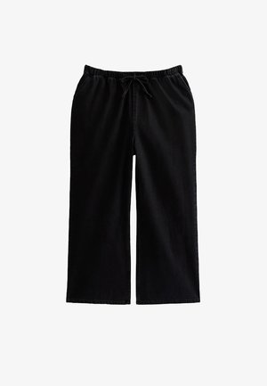 Czarne spodnie o szerokich nogawkach z elastycznym pasem i regulowanym sznurkiem. Posiadają boczne kieszenie oraz gładką, miękką fakturę.