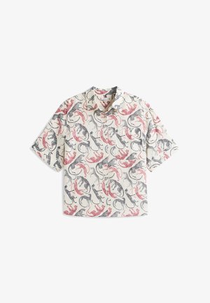 Short-sleeved button-up shirt in light fabric featuring a pattern of red, black, and grey abstract designs on a cream background.