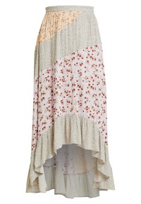 Jupe longue avec un ourlet asymétrique, présentant des motifs floraux rouges, verts et jaunes sur un fond clair. Confectionnée en tissu léger avec des volants.