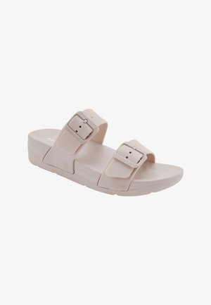 Beige open-toe slip-on sandaal met twee verstelbare gespsluitingen en een licht verhoogde zool.