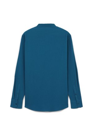 Camicia a maniche lunghe in un solido colore teal profondo, con taglio rilassato, polsini con bottoni e colletto classico. Realizzata in un tessuto testurizzato.