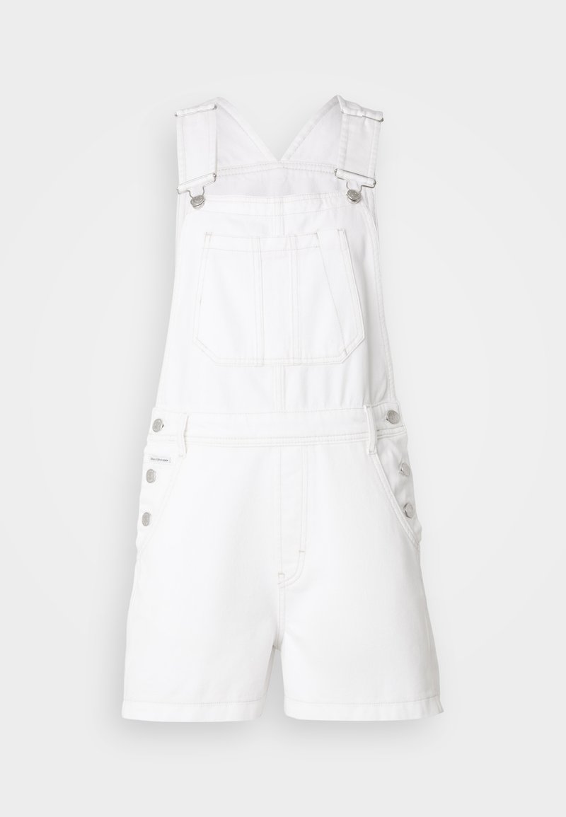 White denim overalls with adjustable straps, front pocket, and button accents on sides. Features short legs and a clean, smooth texture.