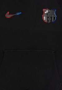 Black hoodie with a front pocket. Features red and blue Nike logo and a black Barcelona FC badge with red and blue accents.
