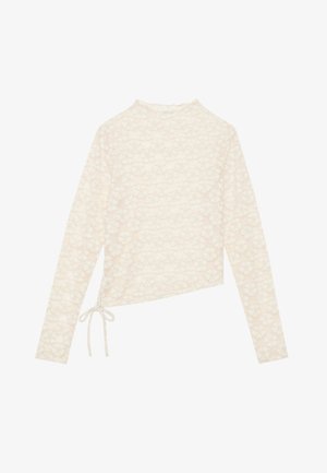 Kreemivärvi pikkade varrukatega top, millel on lilleline pitsmuster, kõrge kaelus ja küljetõmbe detail reguleeritava sobivuse jaoks. Pehme tekstuur ja kerge kangas.