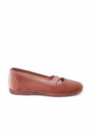 Velvet ballet flats in dusty rose with a round toe, featuring a pink strap across the upper and a flexible rubber sole. Smooth texture.
