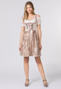 Traditional dress featuring a fitted bodice in light fabric, floral embroidered skirt, and ribbon accents. Complemented by gray shoes.