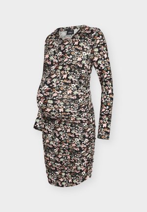 Sukienka ciążowa z długim rękawem, z czarnym tłem i kwiatowym wzorem w kolorach różowym, zielonym oraz białym. Zebrane detale po bokach dla lepszego dopasowania.