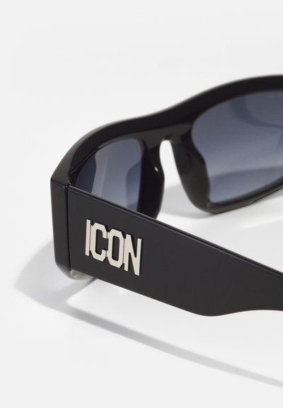 Occhiali da sole neri con finitura lucida. Le aste larghe presentano un logo metallico "ICON". Lenti oscurate, design elegante e bordi arrotondati.