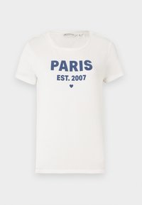 White short-sleeve crew neck T-shirt with dark blue text "PARIS EST. 2007" and a small heart below the text.