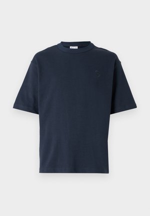 Navy blue short-sleeve t-shirt made of cotton. Features a round neck and a subtle logo on the chest. Straight cut design with no patterns.