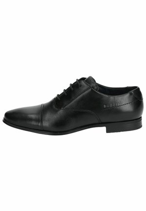 Chaussure habillée en cuir noir avec un bout pointu, des lacets ronds et une discrète marque sur le côté. Texture lisse avec une finition poli.