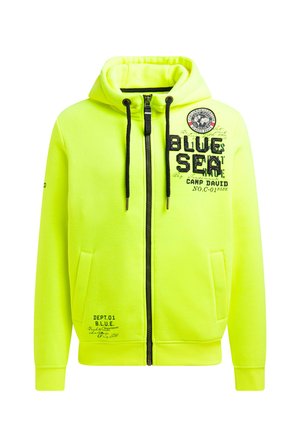 Neon-gelber Kapuzenpullover mit Reißverschluss, Kordelzugkapuze, vorderen Taschen und schwarzen Textgrafiken. Mit gerippten Bündchen und Saum.