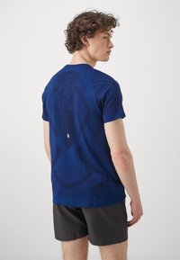 ASICS SEAMLESS TOP - Camiseta deportiva - midnight