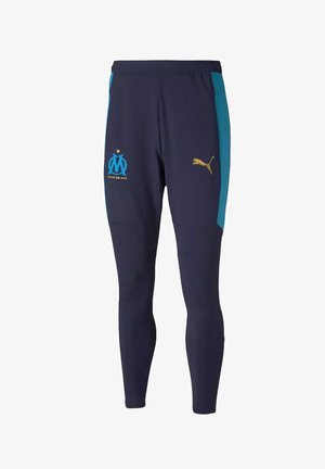 Pantalones deportivos de color navy con paneles laterales turquesa, acentos de logo dorado y un ajuste entallado, fabricados con tejido elástico para mayor comodidad y libertad de movimiento.