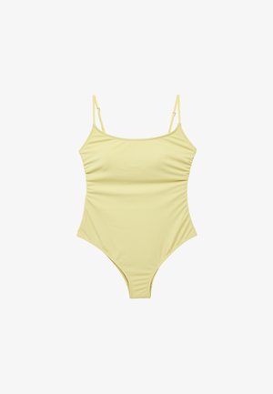 Costume intero giallo pallido con sottili spalline regolabili e sottile arricciatura laterale, disteso su sfondo bianco.