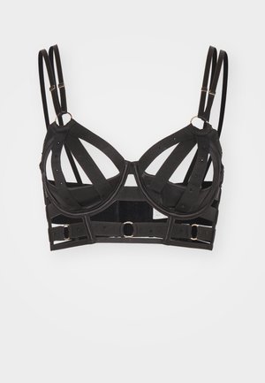 Fekete struktúrált melltartó, kivágott mintákkal és arany részletekkel. Állítható pántokkal és kapcsos záródással rendelkezik a biztonságos illeszkedés érdekében.