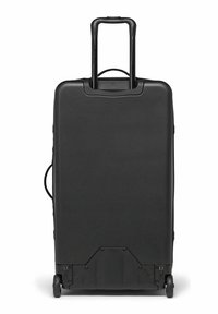 Valise rigide noire avec une poignée rétractable, quatre roues et une poignée latérale. Texture lisse avec un design minimaliste et un matériau durable.