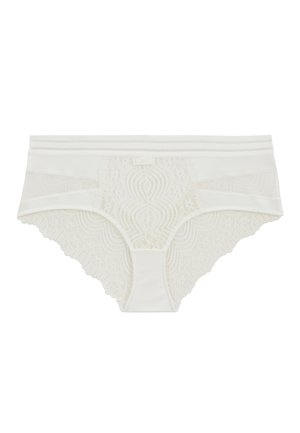 Culotte en dentelle blanche avec des bords festonnés, présentant des motifs floraux et une taille lisse. Fabriquée à partir d'un mélange de dentelle et de tissu.