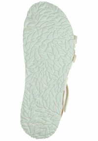 Weißer Schuhsohle mit einem strukturierten Blattmuster-Design. Die Form ist abgerundet mit Konturen entlang der Kanten für Grip und Unterstützung.