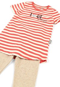 Red and cream striped t-shirt with short sleeves and a round neckline, paired with beige textured leggings featuring colorful speckles.