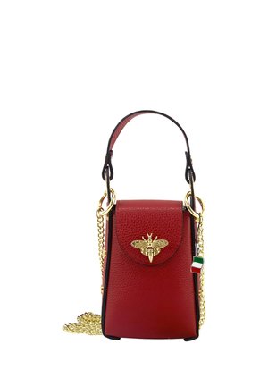 Small red leather handbag with gold bee emblem, short handle, and gold chain strap featuring an Italian flag charm.