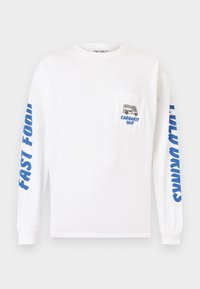 Λευκό πουκάμισο με μακριά μανίκια από βαμβάκι. Διαθέτει μπλε κείμενο στα μανίκια και μια τσέπη με γραφικό ενός φαγητού φορτηγού και το "Carhartt WIP".