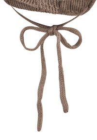 Knit brown cap with a textured surface and adjustable ties. Features a bow detail formed by long, braided ties at the base.