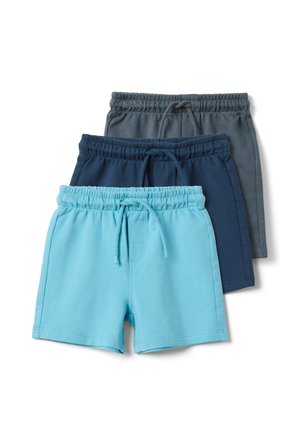 Trois paires de shorts à taille élastique avec cordons en bleu clair, bleu marine et gris empilés sur un fond blanc.
