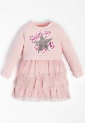 Różowa sukienka z długimi rękawami, z srebrną gwiazdą i błyszczącym napisem. Tiulowa spódnica z warstwowymi falbanami dodaje tekstury. Miękki materiał.