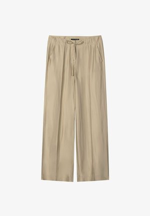 Beige Hosen mit weitem Bein, einem elastischen Bund, einem Kordelzug und Seitentaschen, die für die Freizeitgestaltung konzipiert sind.