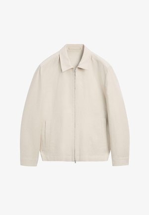 Hellbeige Reißverschlussjacke mit Kragen und langen Ärmeln, ausgestattet mit zwei vertikalen Fronttaschen und einem minimalistischen Design.