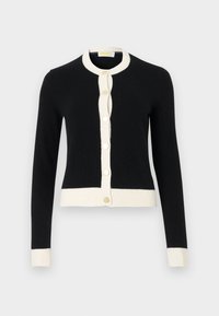 Gilet noir avec un col et des poignets en maille blanche, doté d'un devant à boutons avec des boutons ronds dorés. Texture lisse, design ajusté.