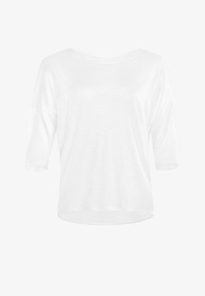 Bijela, lagana, košulja s dugim rukavima širokog izreza i opuštenim krojem. Mekana tekstura, zaobljeni rub i rukavi do polovice.