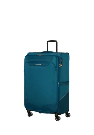 Grande valigia morbida blu con tasca frontale, manico retrattile, quattro ruote girevoli e serratura a combinazione montata lateralmente.