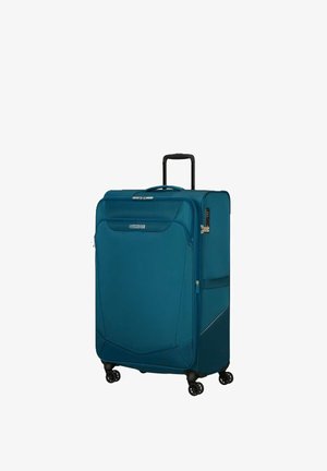 Grande valigia morbida blu con tasca frontale, manico retrattile, quattro ruote girevoli e serratura a combinazione montata lateralmente.