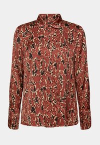 Camicia a maniche lunghe rossa e crema con un motivo astratto nero. Caratterizzata da un colletto e una pattina con bottoni, realizzata in tessuto liscio.