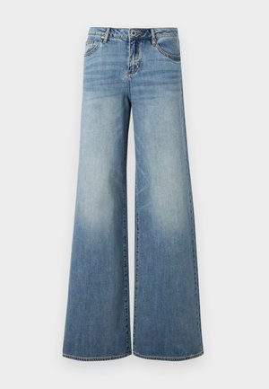 Šviesiai mėlynos plačios kojų džinsai, pagaminti iš džinsinio audinio su nublukusiu apdaila. Yra penki kišeniai, sagtys ir kontrastingos siūlės.